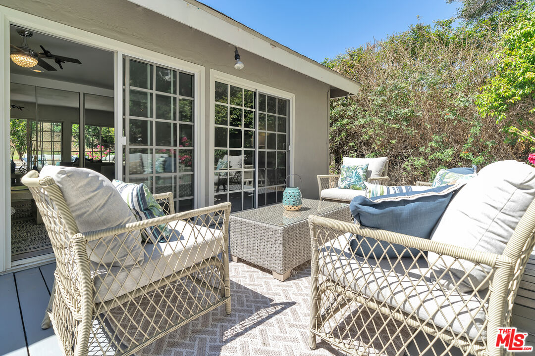8330 Zitola Terrace Playa del Rey, CA 90293 - Photo 35 of 48 a view of a patio with couches chairs and wooden floor