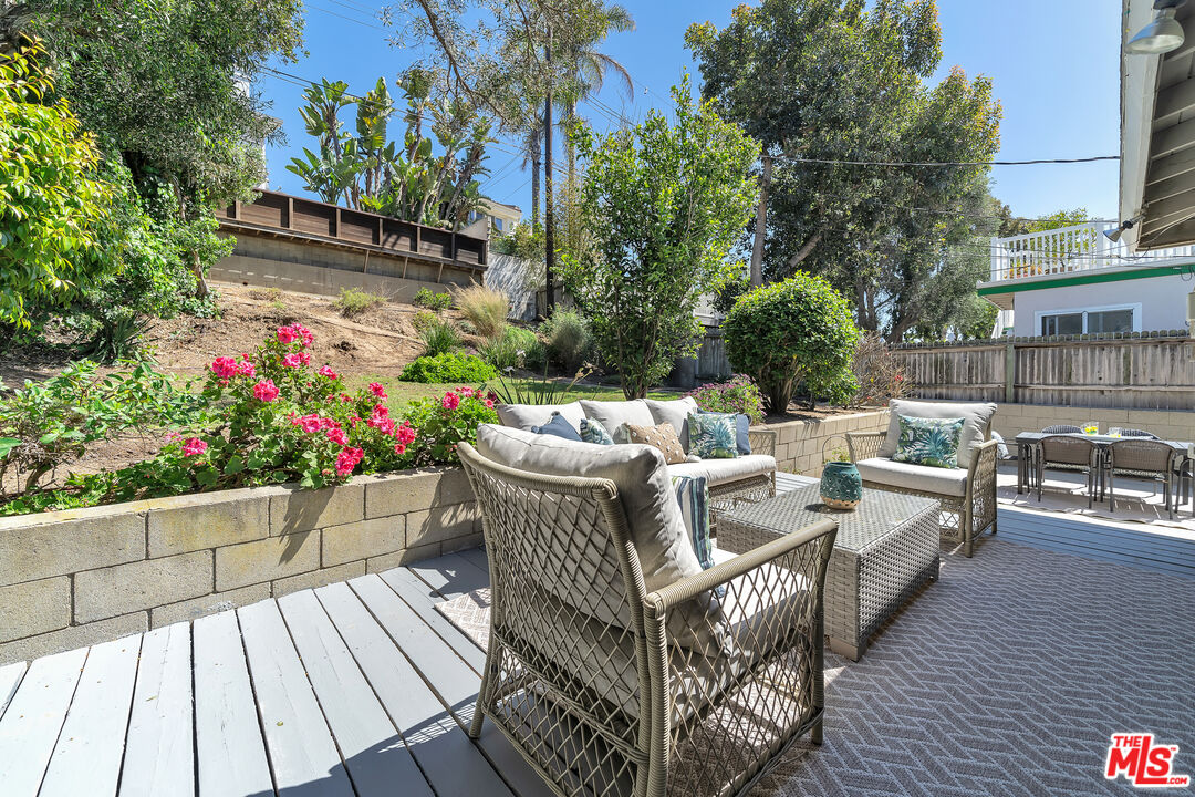 8330 Zitola Terrace Playa del Rey, CA 90293 - Photo 37 of 48 a view of a patio with couches table and chairs and potted plants