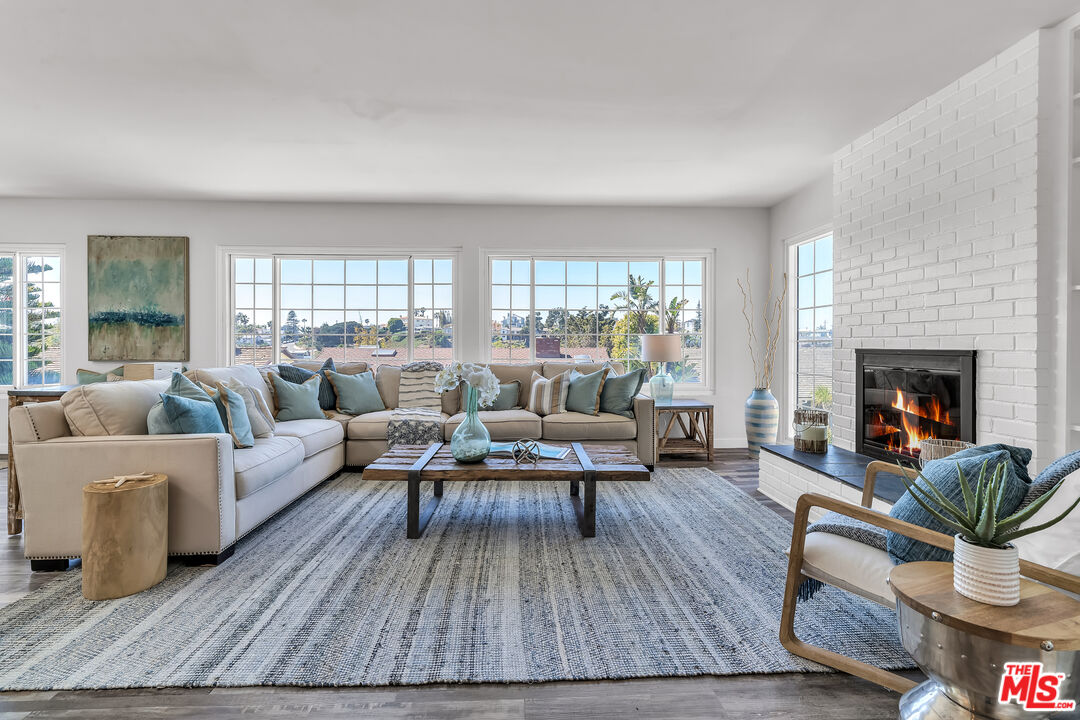8330 Zitola Terrace Playa del Rey, CA 90293 - Photo 8 of 48 a living room with furniture and a fireplace