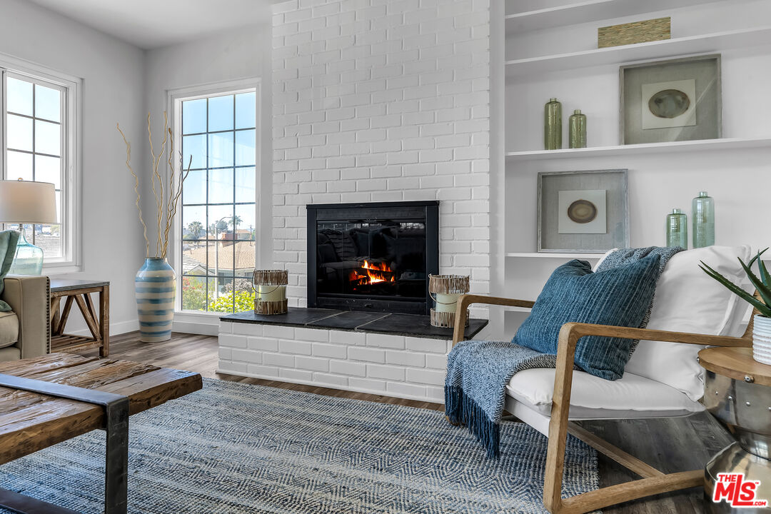 8330 Zitola Terrace Playa del Rey, CA 90293 - Photo 10 of 48 a living room with furniture and a fireplace