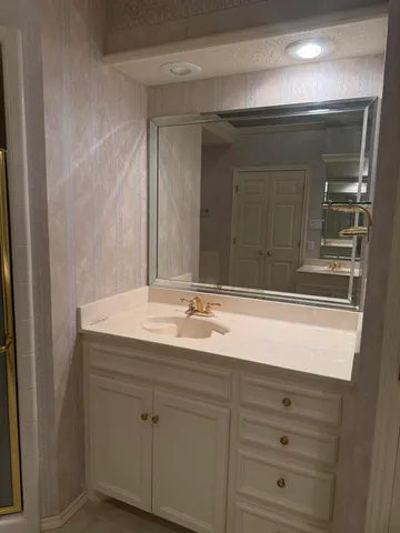 a bathroom with a sink and a mirror