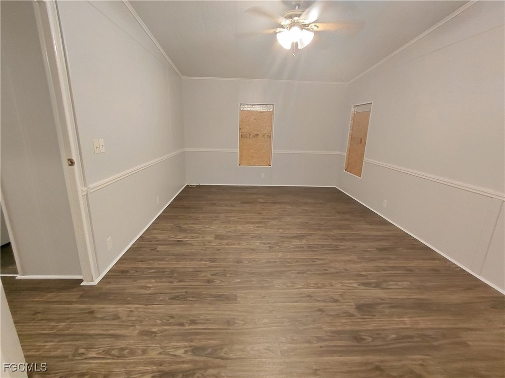 708 Bowden Road Clewiston, FL 33440 - Photo 13 of 44 wooden floor in an empty room