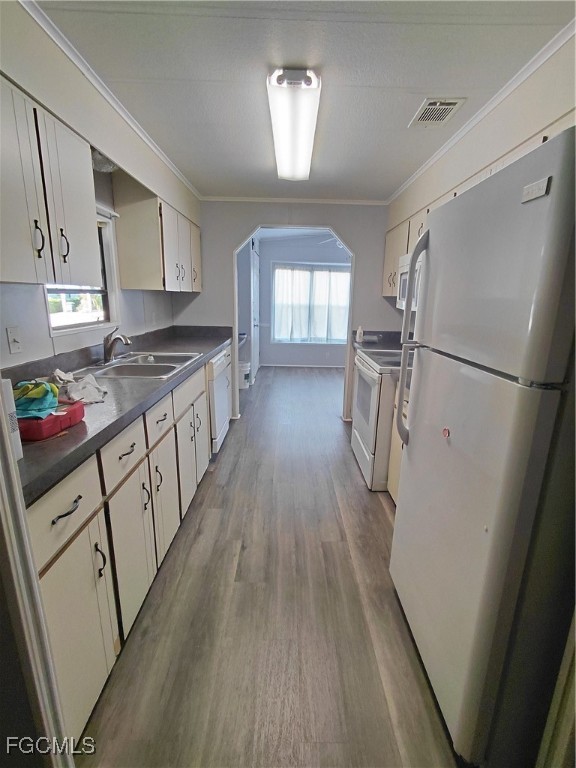 708 Bowden Road Clewiston, FL 33440 - Photo 14 of 44 a kitchen with sink a refrigerator and a stove