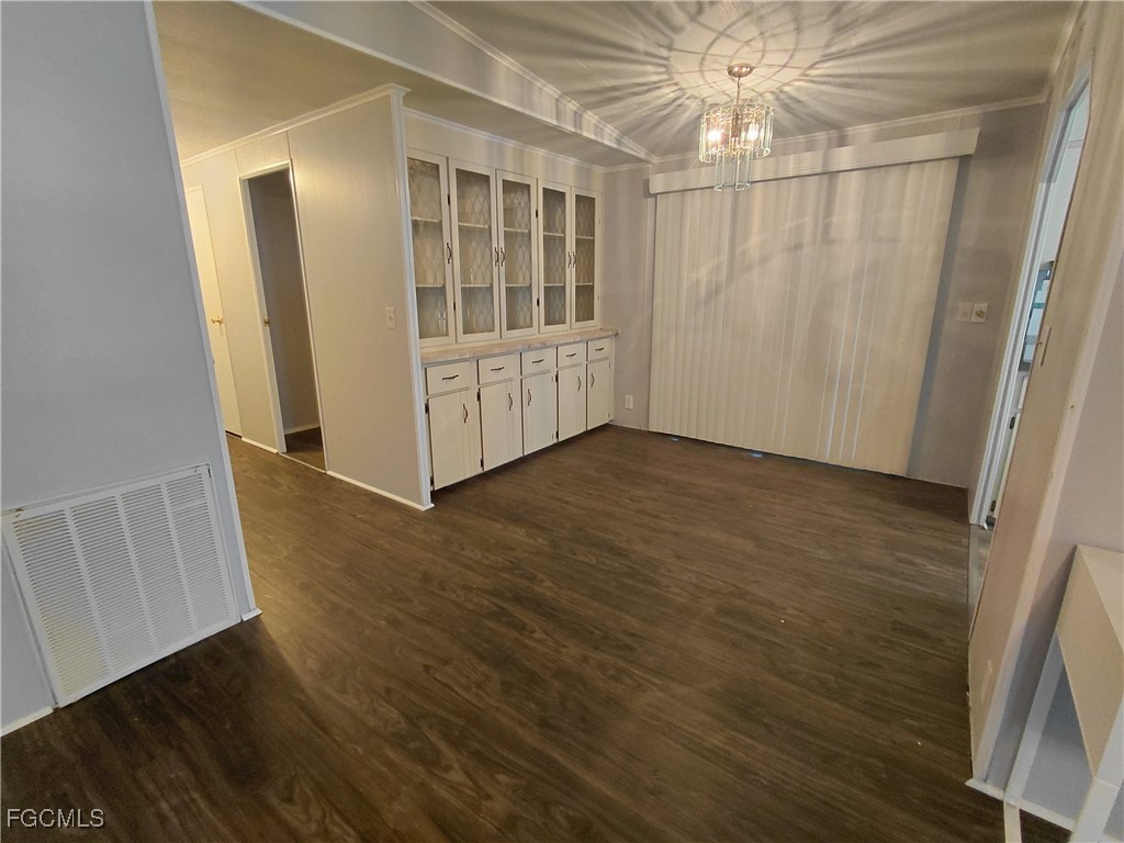 708 Bowden Road Clewiston, FL 33440 - Photo 27 of 44 a view of an entryway with wooden floor