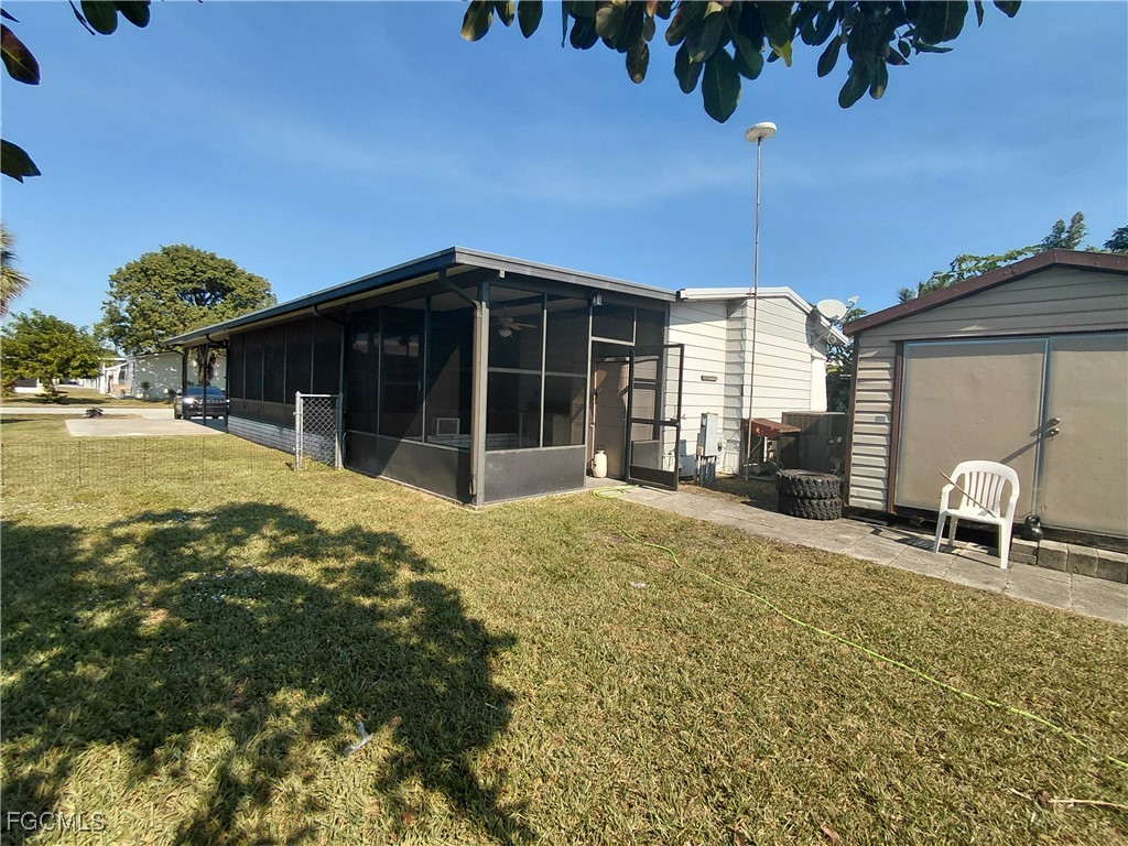 708 Bowden Road Clewiston, FL 33440 - Photo 30 of 44 a house view with a backyard space