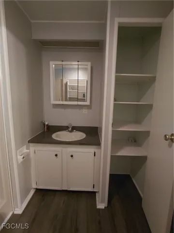 a white toilet sitting next to a bathroom sink