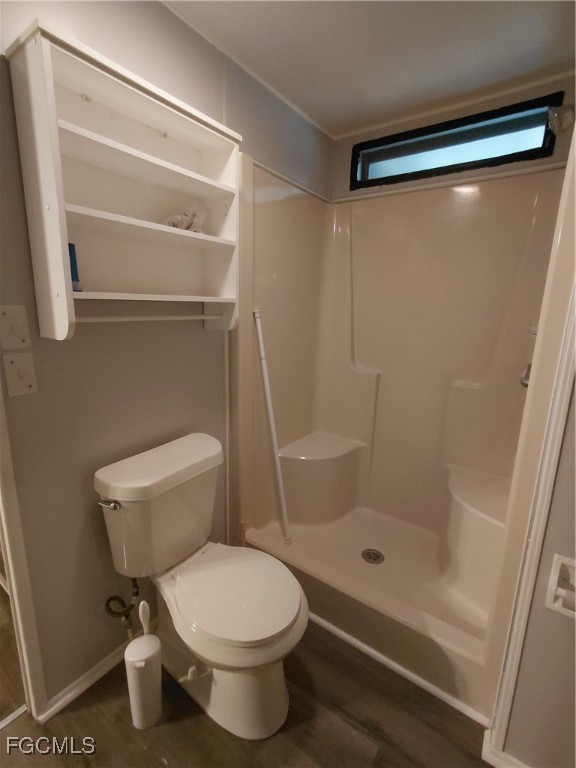 708 Bowden Road Clewiston, FL 33440 - Photo 36 of 44 a bathroom with a toilet and a shower