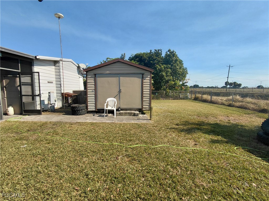 708 Bowden Road Clewiston, FL 33440 - Photo 37 of 44 a view of a house with a yard