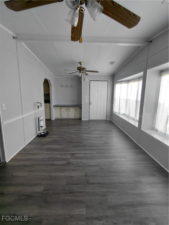 708 Bowden Road Clewiston, FL 33440 - Photo 4 of 44 a view of empty room with wooden floor and fan