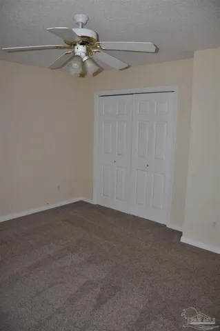 a white toilet sitting next to a bath tub