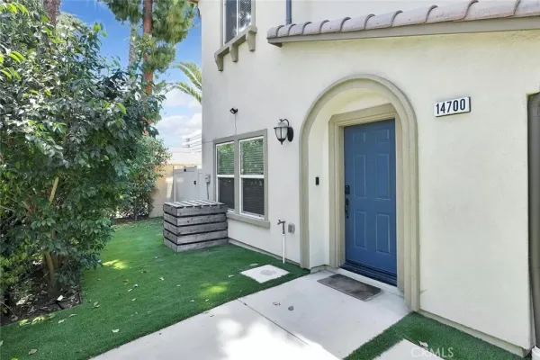 a view of a wooden door in the backyard
