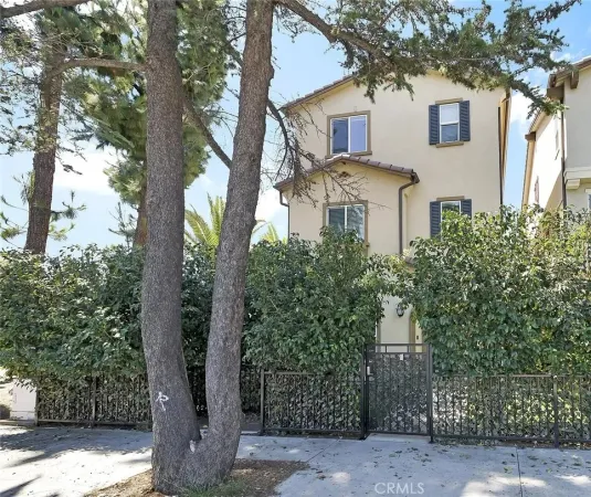 a front view of a house with trees