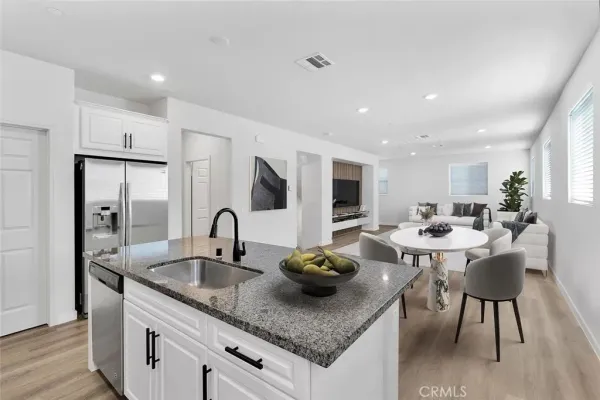a kitchen with counter space a sink and appliances