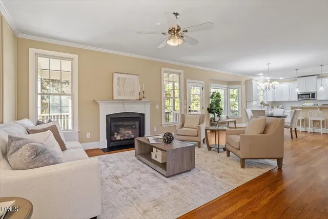 a living room with furniture fireplace and window