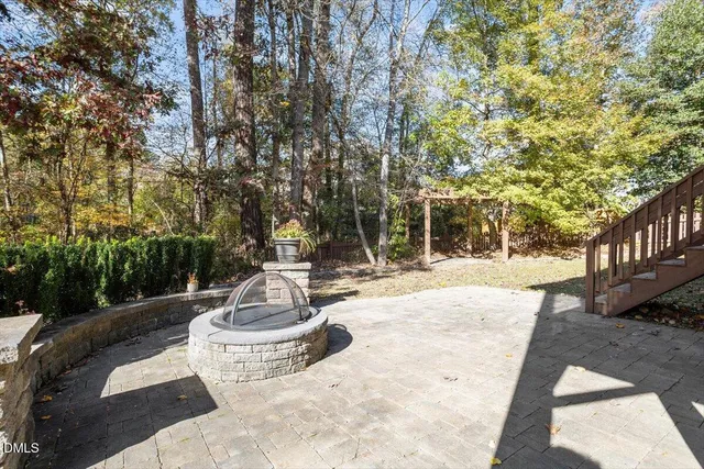 a front view of a house with plants and entryway