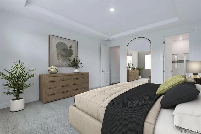 a bedroom with a bed and a potted plant