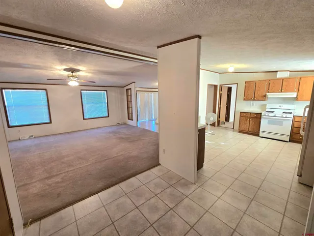 a spacious bathroom with a granite countertop sink and a mirror
