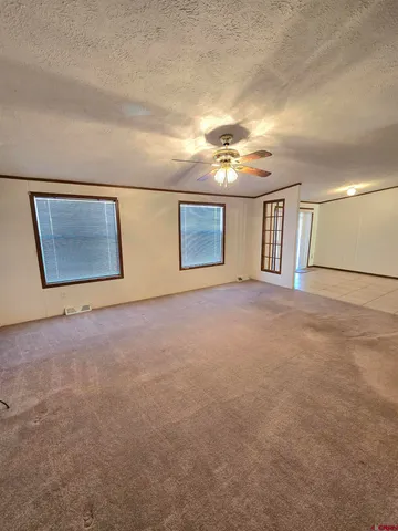 a view of an empty room with windows