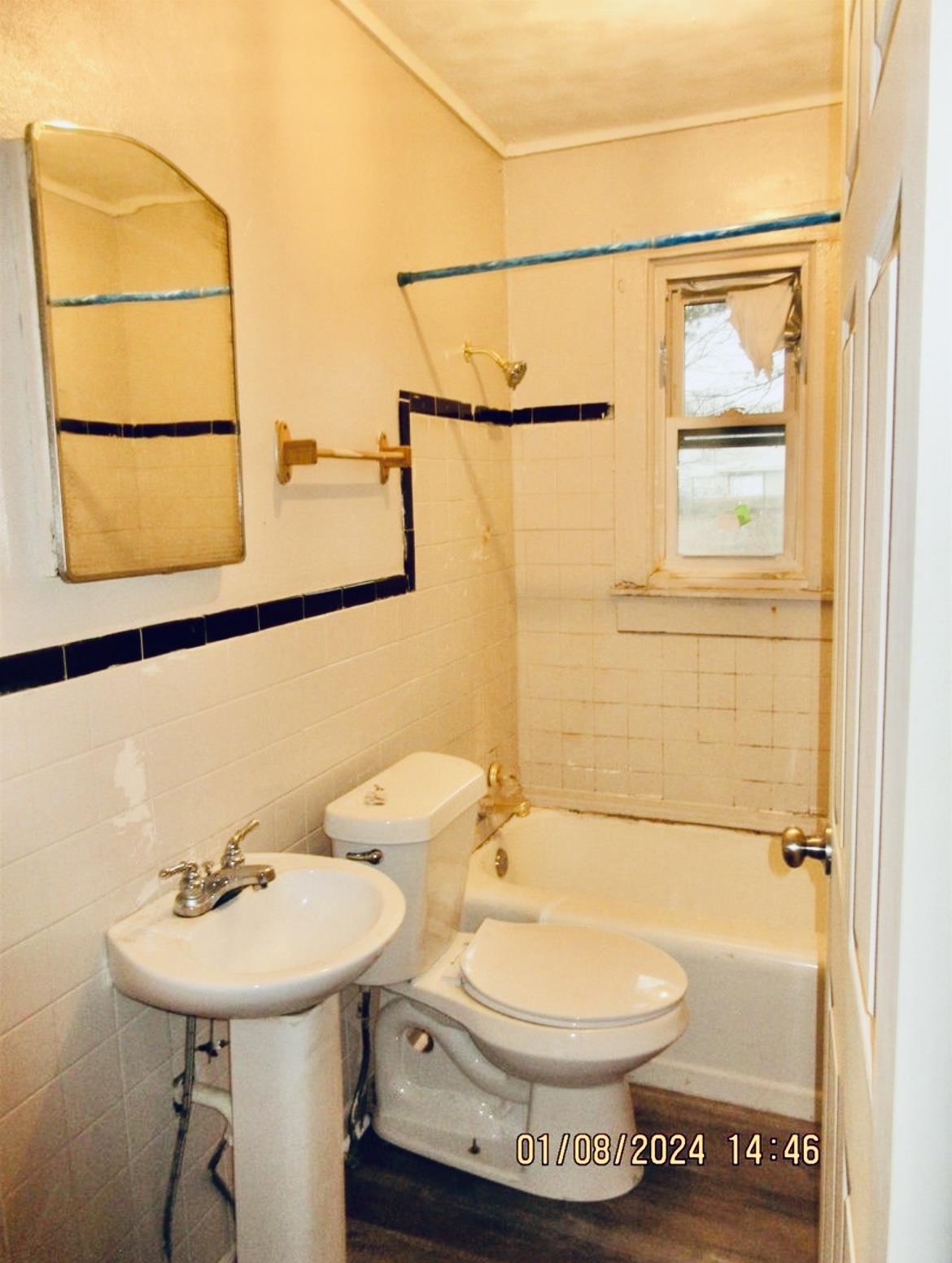 493 Perkins Street Ripley, TN 38063 - Photo 11 of 12 a bathroom with a sink a toilet and shower