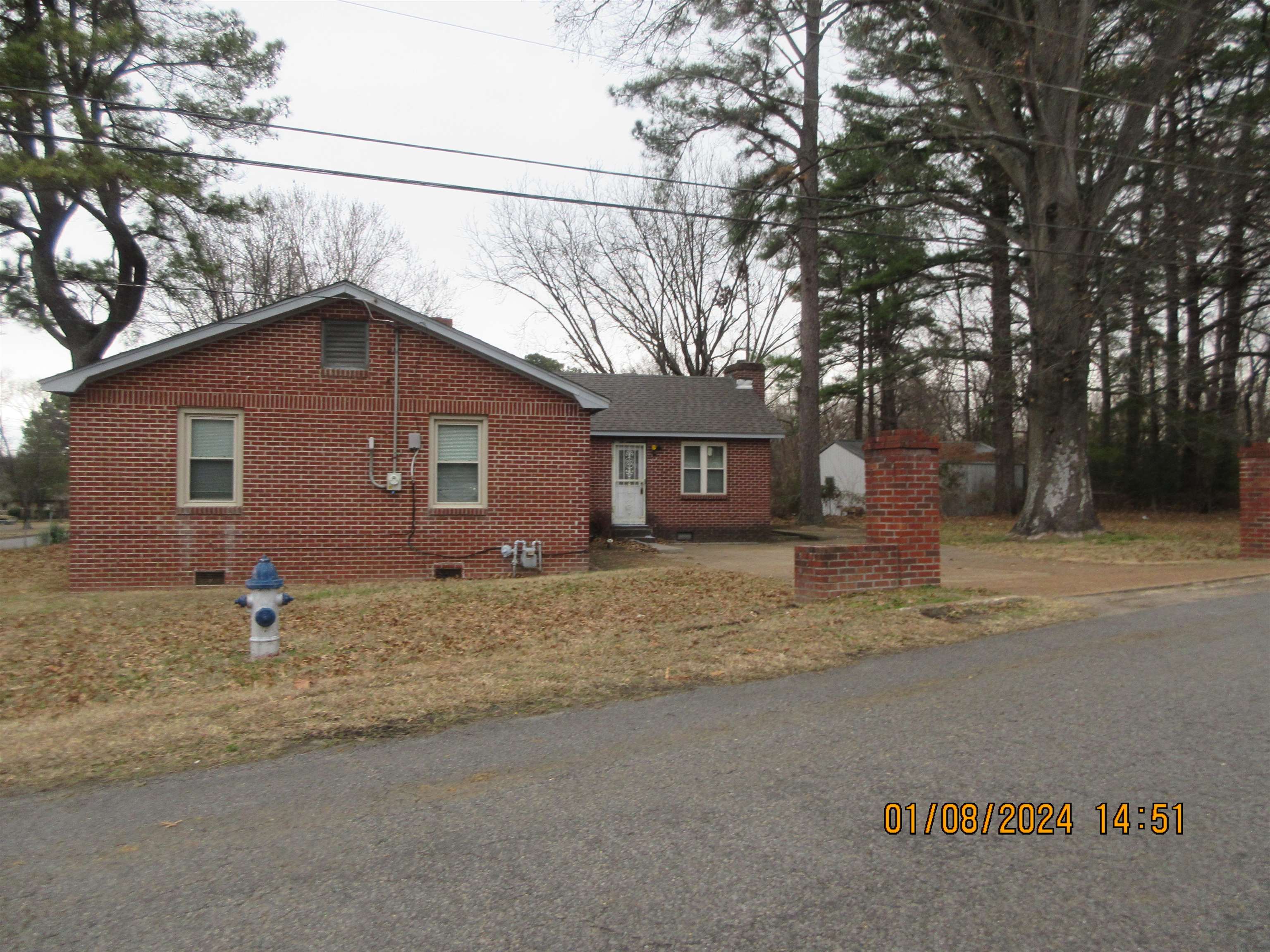 493 Perkins Street Ripley, TN 38063 - Photo 12 of 12 a front view of a house with a yard and garage