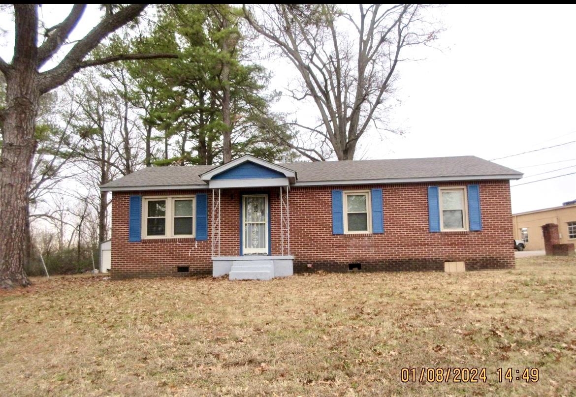 493 Perkins Street Ripley, TN 38063 - Photo 2 of 12 a front view of a house with a yard