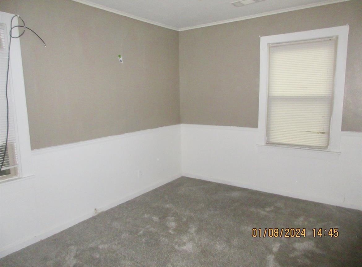493 Perkins Street Ripley, TN 38063 - Photo 7 of 12 an empty room with a empty space