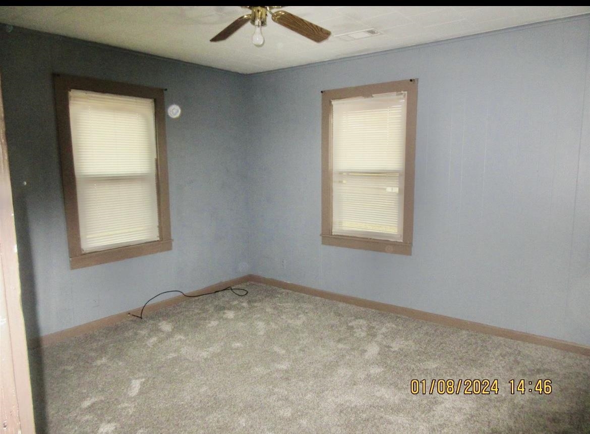 493 Perkins Street Ripley, TN 38063 - Photo 8 of 12 an empty room with a window