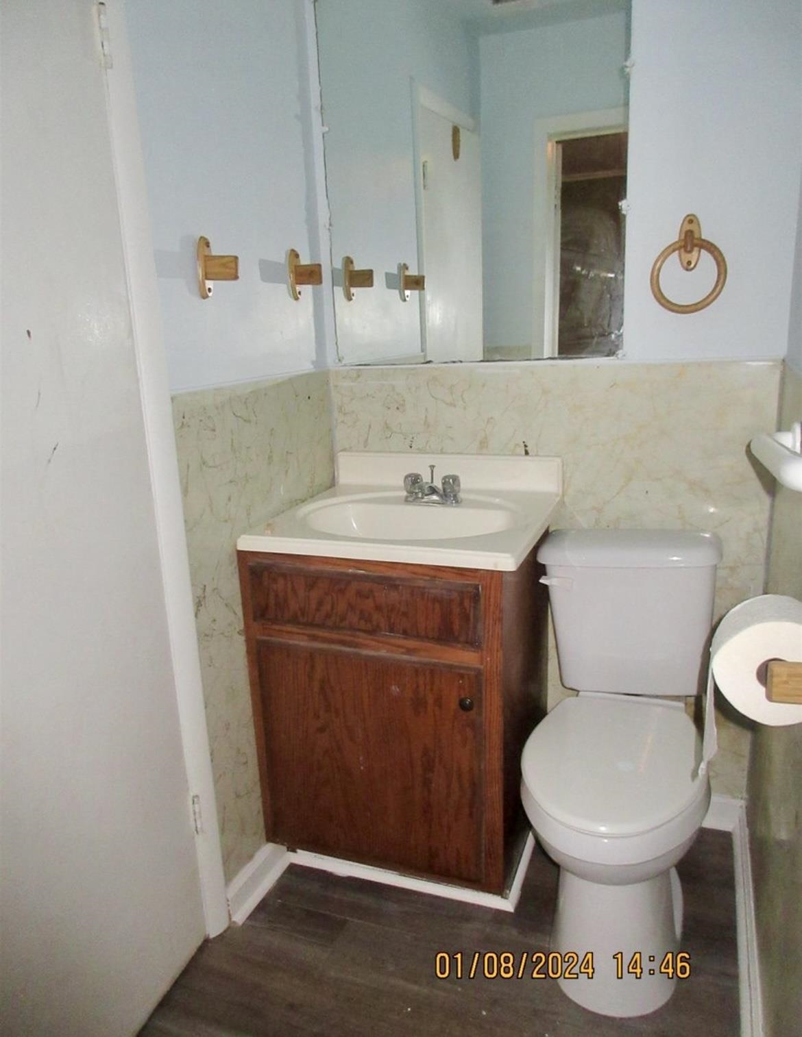 493 Perkins Street Ripley, TN 38063 - Photo 9 of 12 a bathroom with a toilet a sink and a mirror