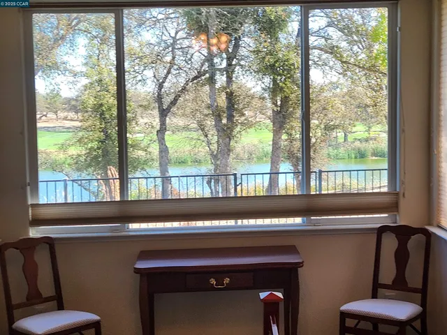 a room with furniture and a large window