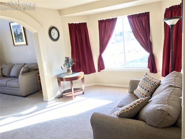 9275 Rockingham Drive Peyton, CO 80831 - Photo 4 of 26 Formal Dining Room with Arched Entry into Living Room.