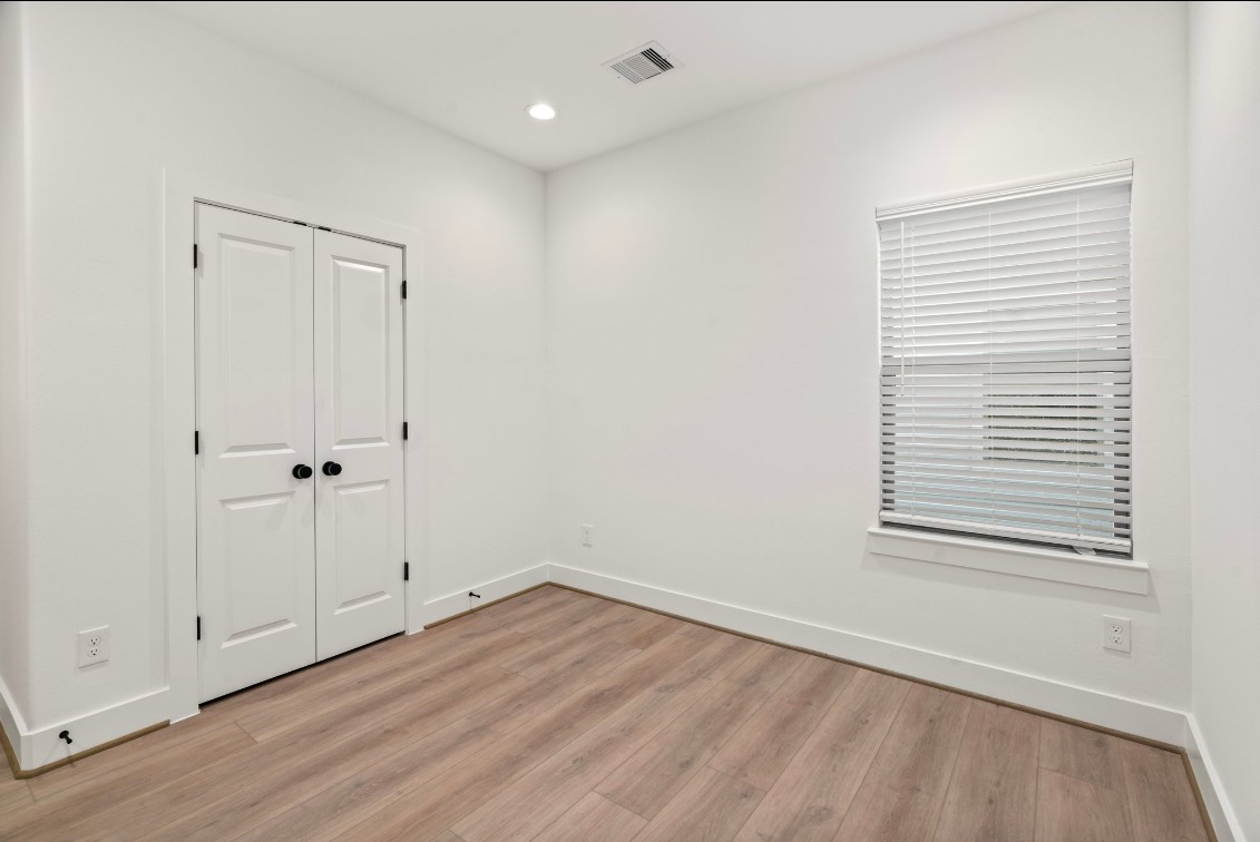 816 Curtin Street, Unit D Houston, TX 77018 - Photo 12 of 30 wooden floor in an empty room