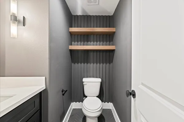 a bathroom with a toilet and a sink