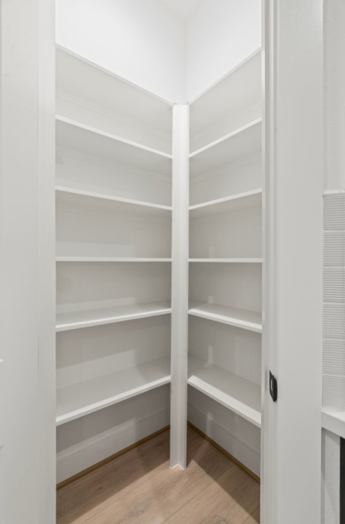 816 Curtin Street, Unit D Houston, TX 77018 - Photo 21 of 30 a view of walk in closet with empty racks