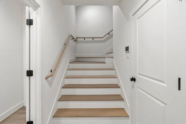 a view of staircase with white walls and white walls