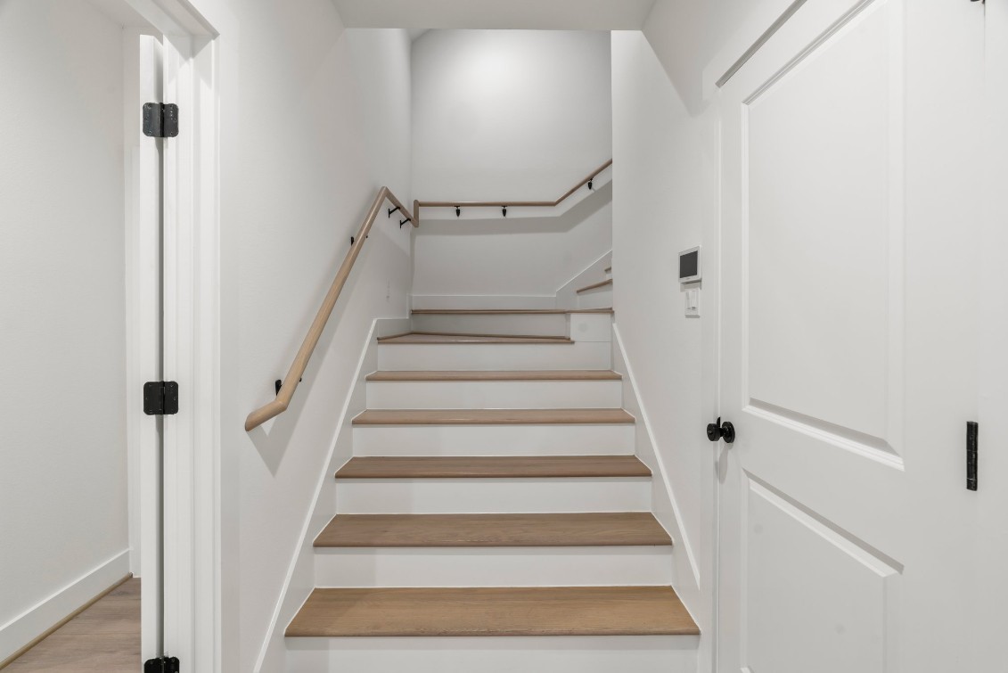 816 Curtin Street, Unit D Houston, TX 77018 - Photo 25 of 30 a view of staircase with white walls and white walls