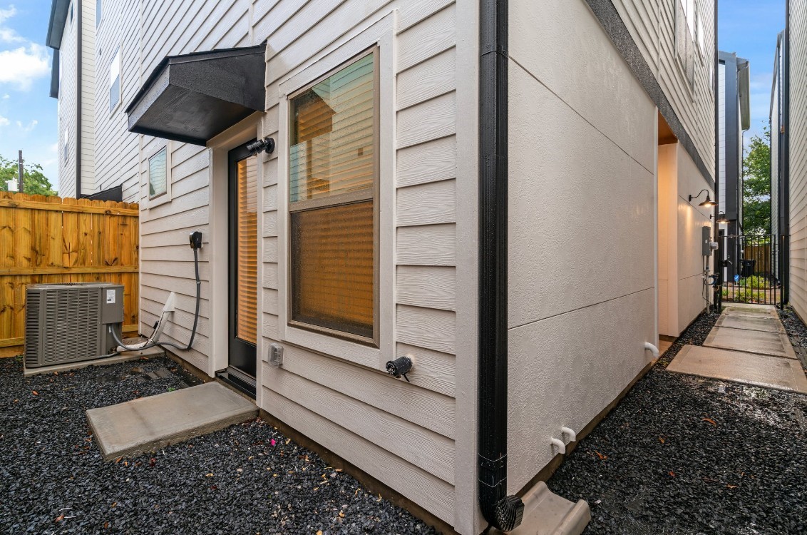 816 Curtin Street, Unit D Houston, TX 77018 - Photo 27 of 30 a view of a balcony a door and wooden floor