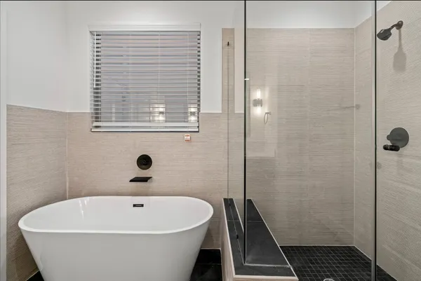 a white bath tub sitting in a bathroom