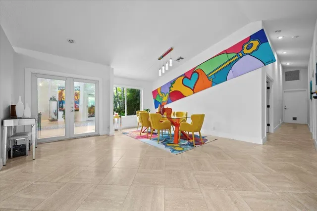 a living room with furniture and air hockey table