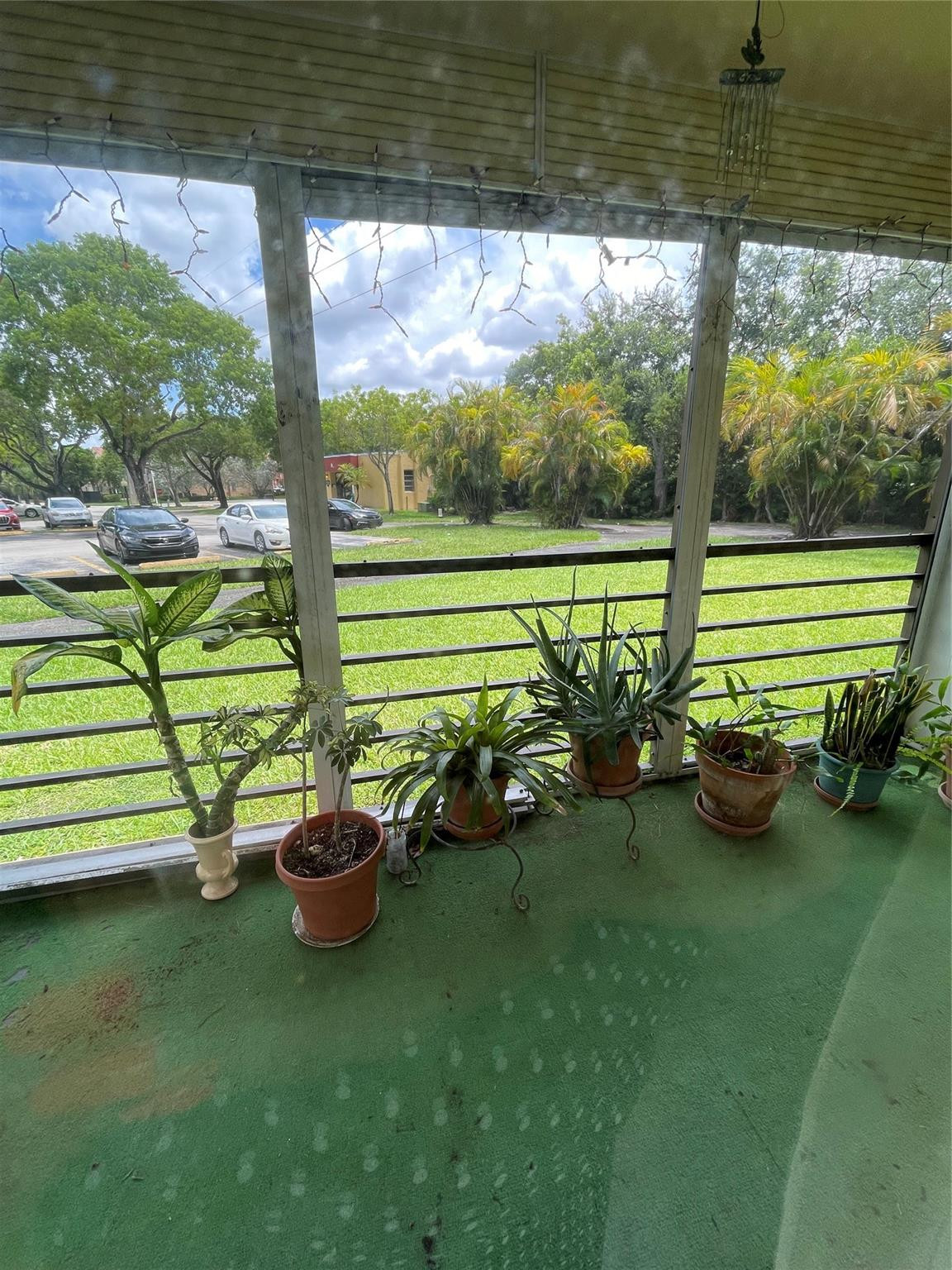 3490 Foxcroft Road, Unit B101 Miramar, FL 33025 - Photo 5 of 10 a view of a garden with lawn chairs