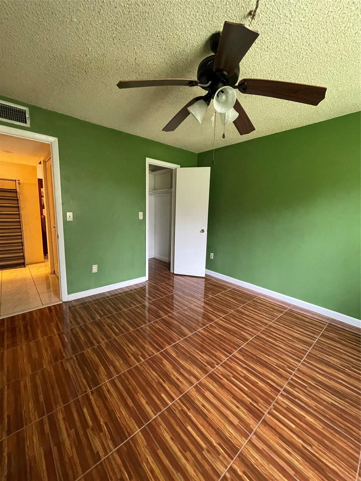 3490 Foxcroft Road, Unit B101 Miramar, FL 33025 - Photo 6 of 10 a view of a room with a wooden floor