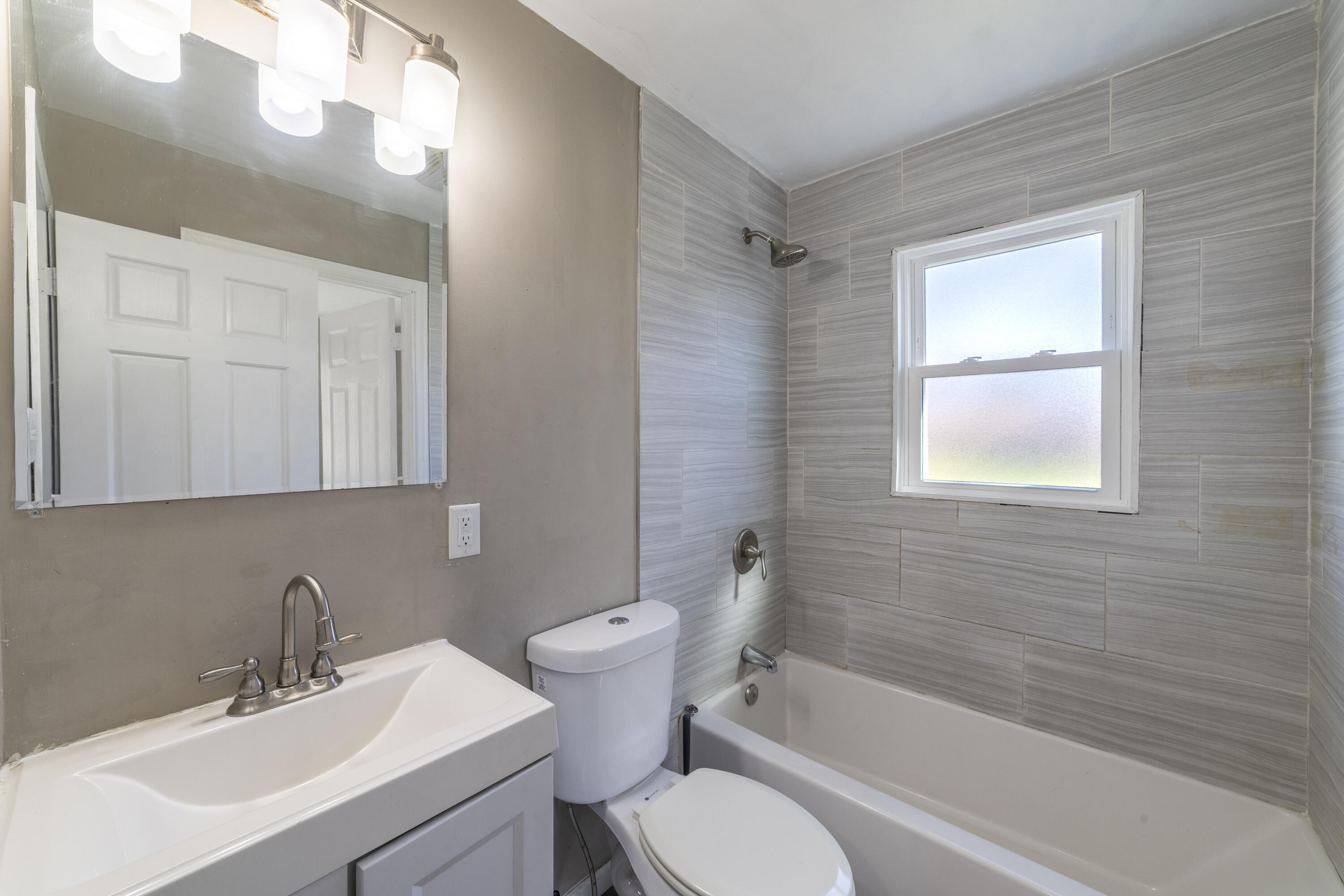 765 Governor Road Valparaiso, IN 46385 - Photo 11 of 26 a bathroom with a sink toilet and shower