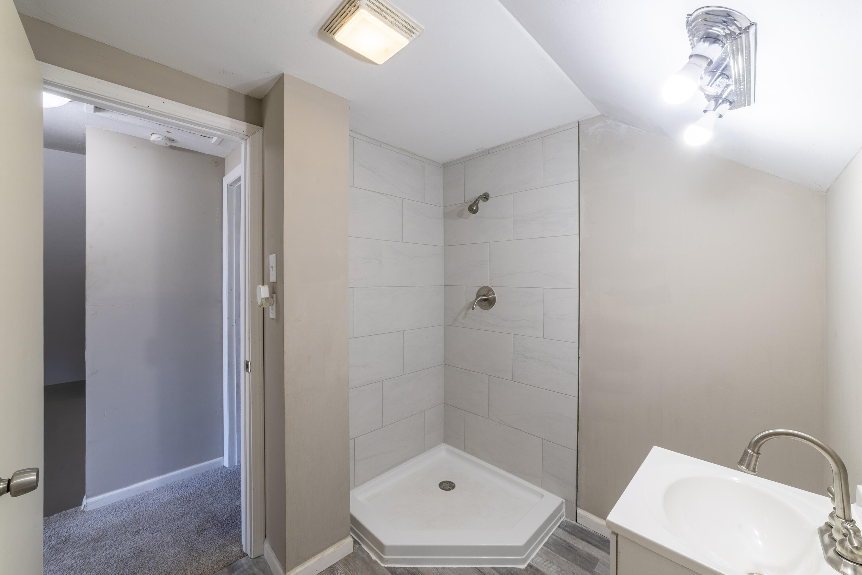 765 Governor Road Valparaiso, IN 46385 - Photo 15 of 26 a bathroom with a sink a toilet and shower