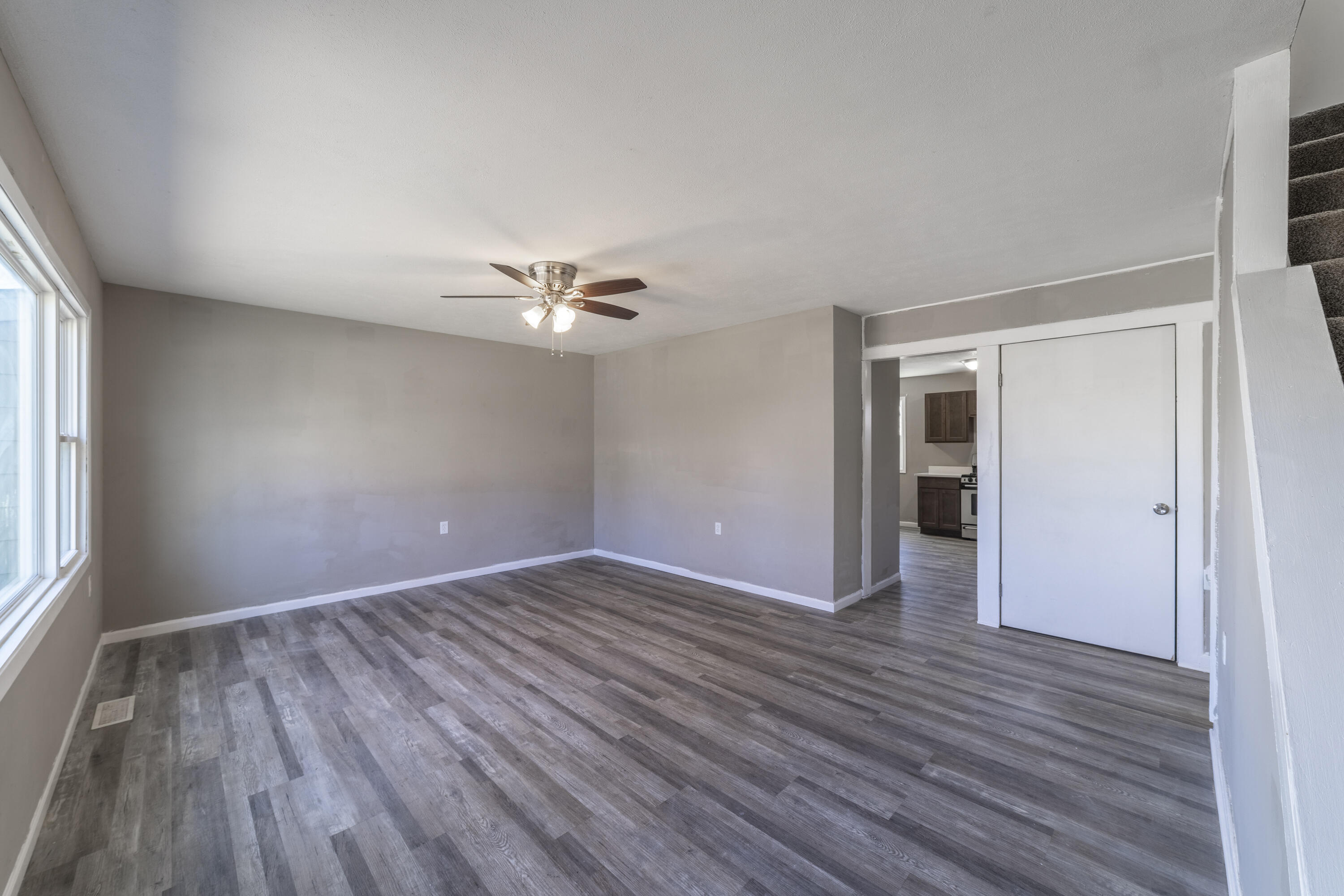 765 Governor Road Valparaiso, IN 46385 - Photo 5 of 26 a view of an empty room with wooden floor and a window
