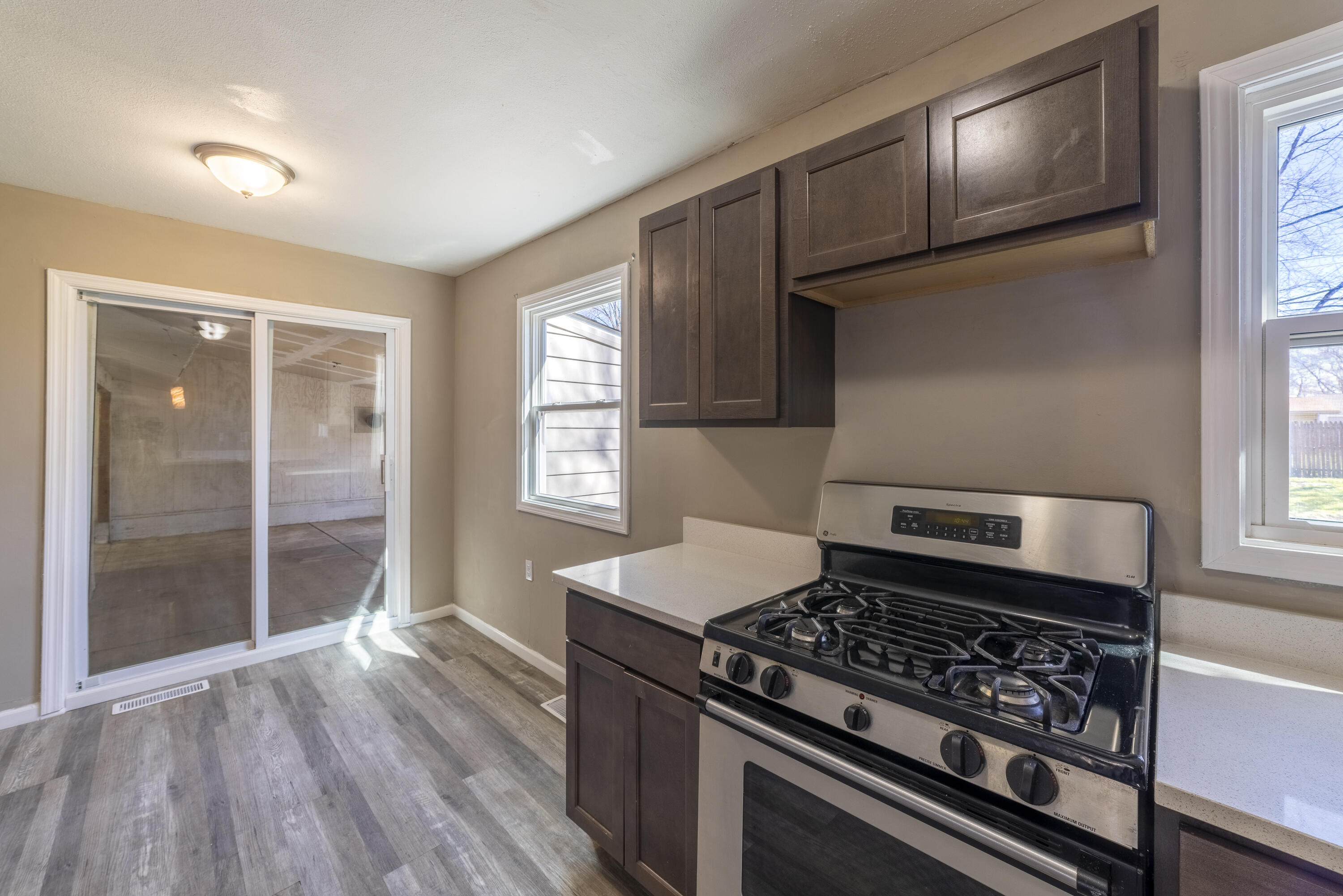 765 Governor Road Valparaiso, IN 46385 - Photo 8 of 26 a kitchen with wooden floors and a stove top oven
