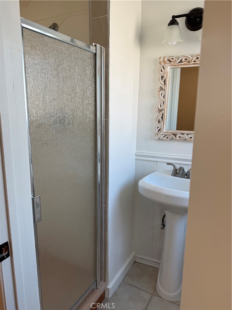 1353 Pengra Street Duarte, CA 91010 - Photo 12 of 18 a bathroom with a sink a mirror and a toilet