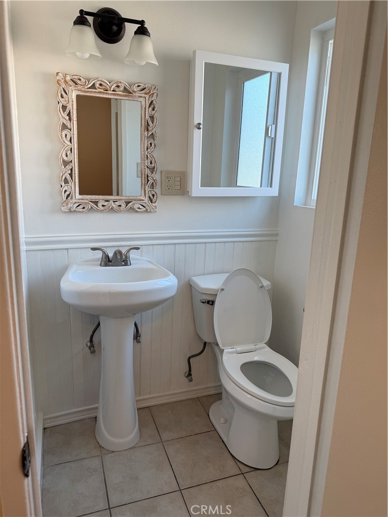1353 Pengra Street Duarte, CA 91010 - Photo 14 of 18 a bathroom with a toilet sink and mirror