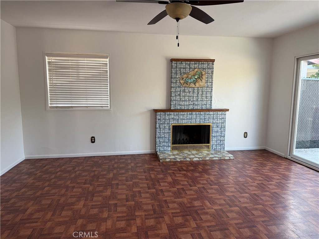 1353 Pengra Street Duarte, CA 91010 - Photo 6 of 18 a view of an empty room with a fireplace and a window