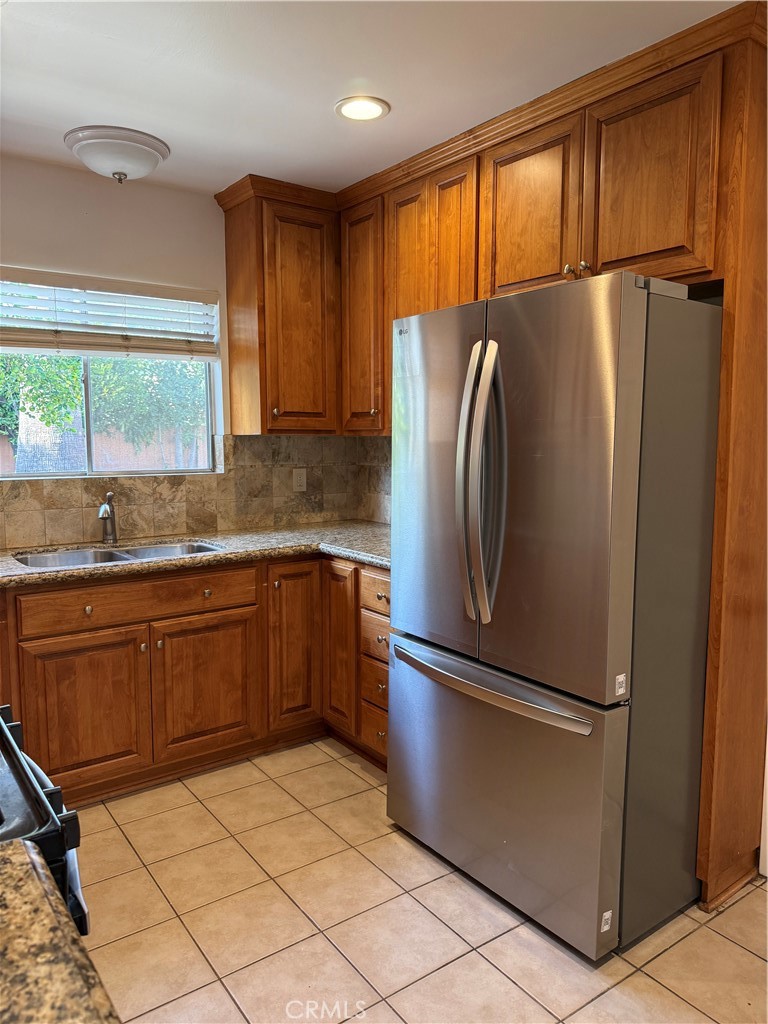 1353 Pengra Street Duarte, CA 91010 - Photo 7 of 18 a kitchen with granite countertop a refrigerator and a sink