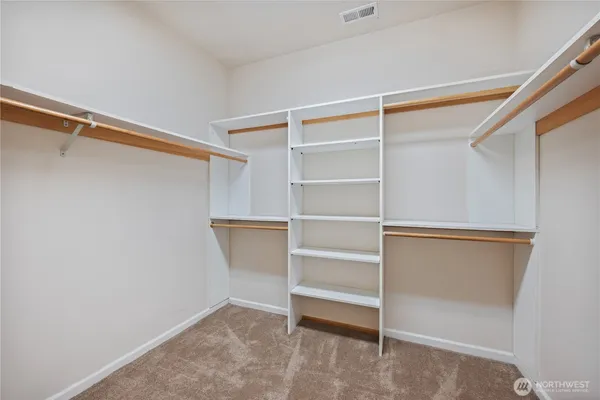 a view of an empty walk in closet