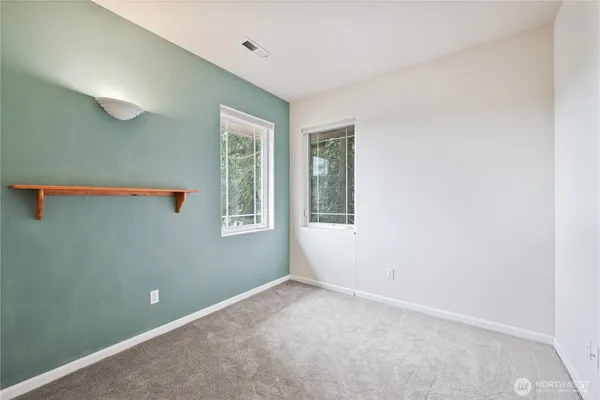a view of a room that has a window in it